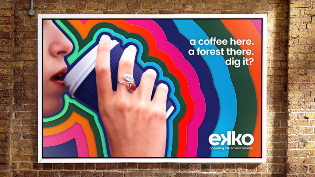 ekko billboard poster of a woman drinking coffee with the words: "a coffee here. a forest there. dig it?"